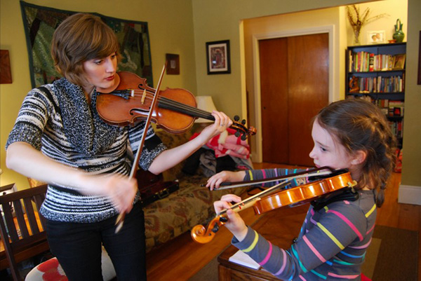 Megan Teaching Violin